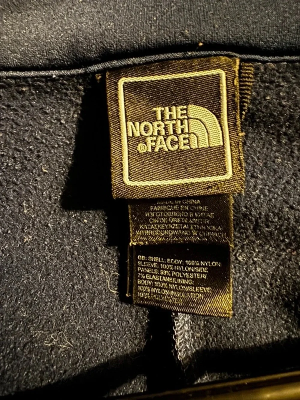 The North Face Black Jacket with Yellow Logo Tag
